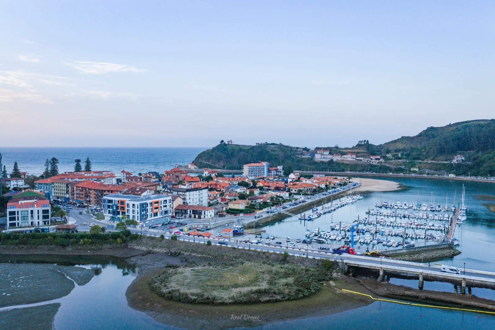 Aerial view of Ribadesella, its harbour and the coastline at dusk