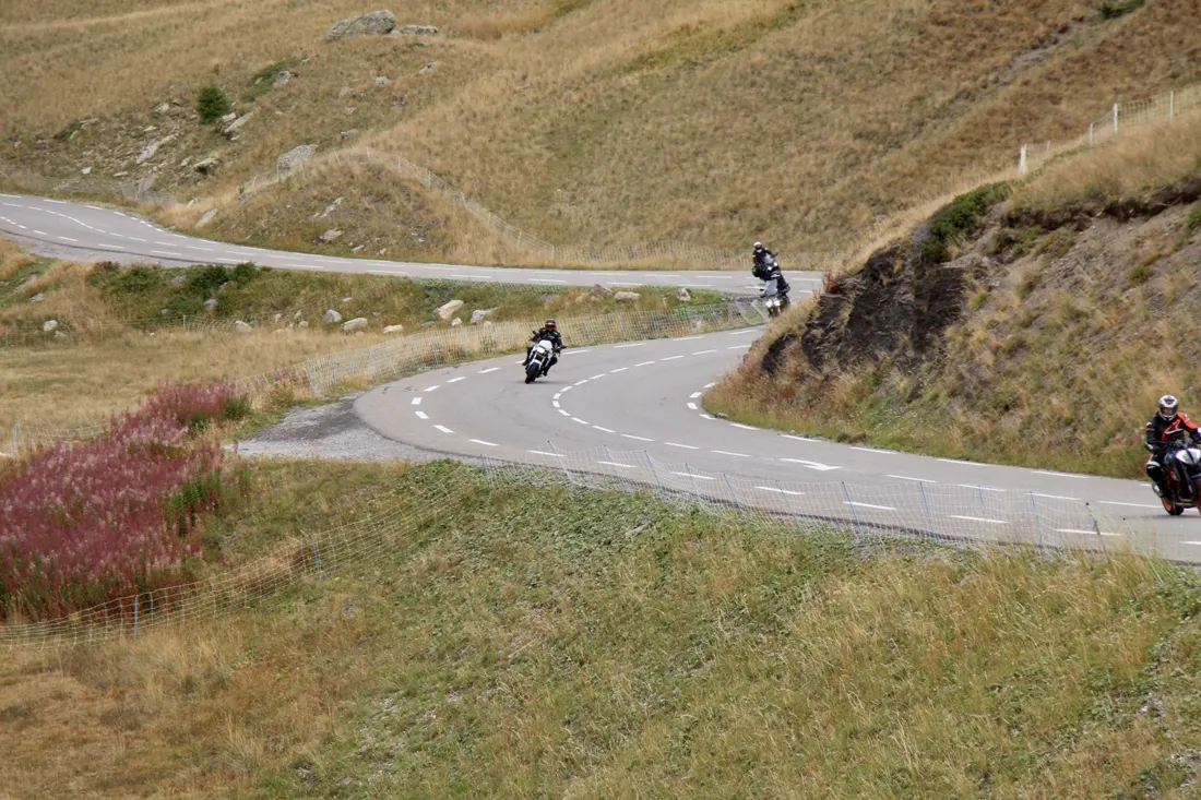 Rider with touring motorcycle on a mountain road