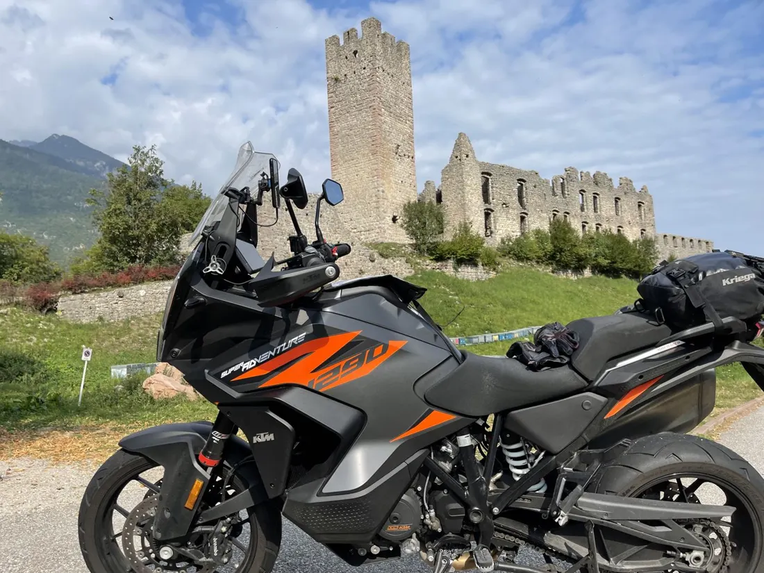 Touring motorcycle beside a mountain lake