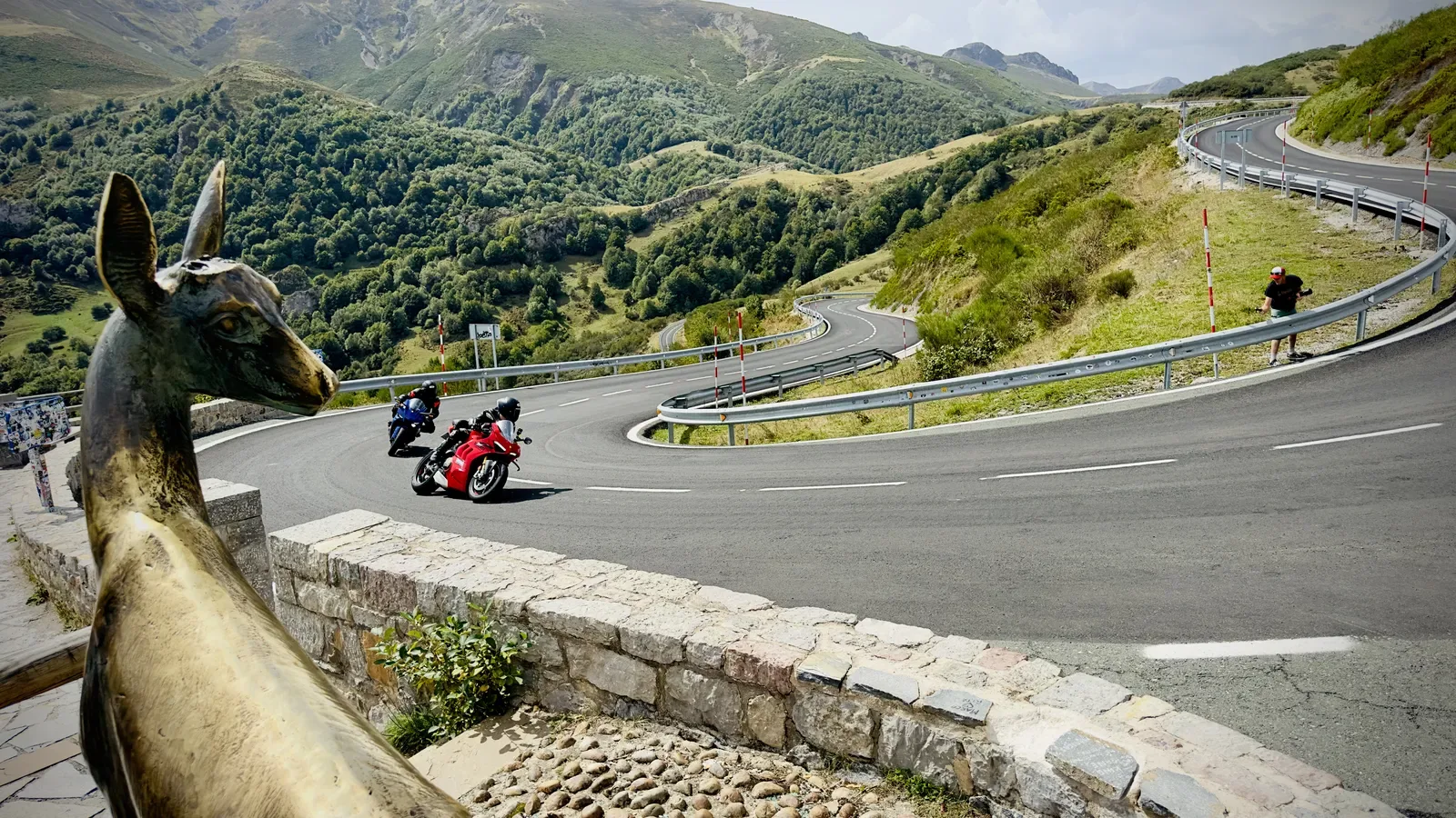 Motorcycles riding mountain hairpins in northern Spain on Day 1 of Cannonball Viberia