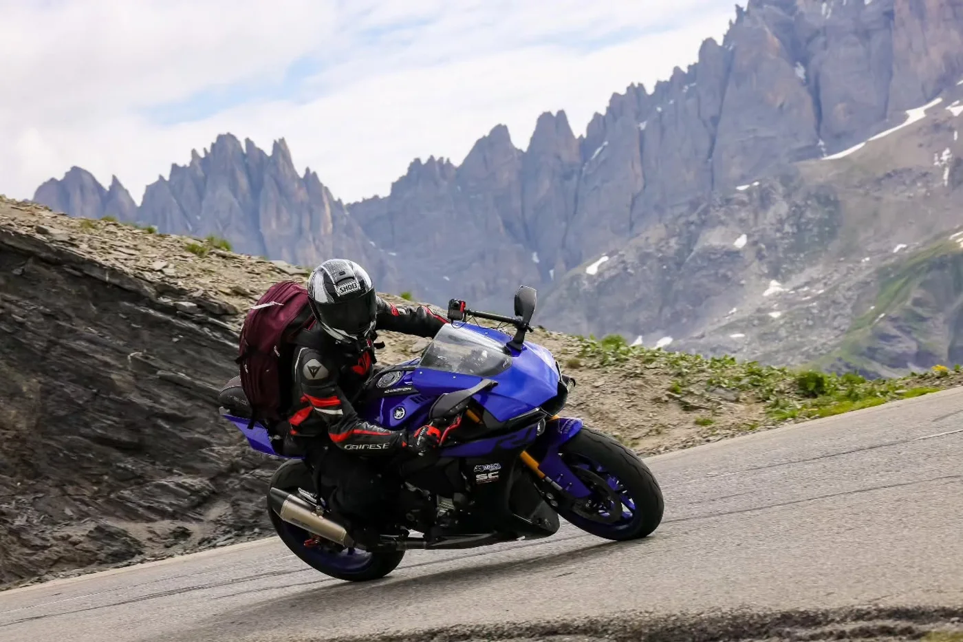 Jeremy Simmons cornering his blue Yamaha R1 on a high mountain pass